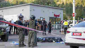 A Palestinian attacker kills at least 4 people at a West Bank gas station