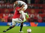 Watch: Manchester United defender Raphael Varane gets into WrestleMania mode, decides to spear Liverpool opponent