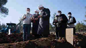 Turkey buries its earthquake dead in small cemeteries and mass graves