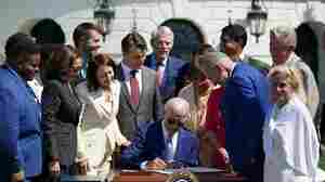 Biden signs semiconductor bill into law, though Trump raid overshadows event