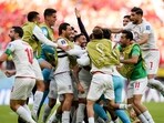 Iran leave it late against 10-man Wales