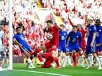 Ten-man Chelsea hold on for point at Liverpool