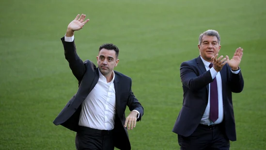 Barcelona fans welcome new coach Xavi at the Camp Nou