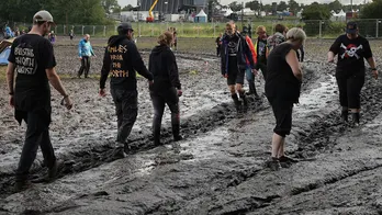 Germany's Wacken Open Air heavy metal festival opens at reduced capacity due to persistent rain