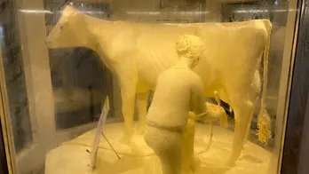 Illinois Gov. JB Pritzker unveils 800-pound butter cow sculpture ahead of annual agricultural extravaganza