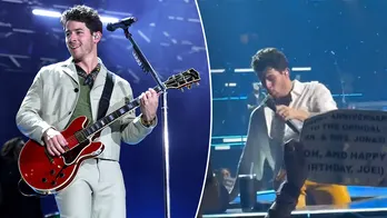 Nick Jonas falls into a hole while performing at Jonas Brothers concert