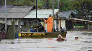 A cyclone has killed over 20 people in Brazil, with more flooding expected