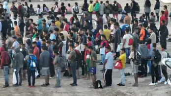 Over 2,200 migrants caught on video illegally crossing border near Eagle Pass, Texas, overnight, sources say