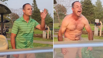 Golfer rips off shirt, flexes muscles and challenges another player to a fight in viral video