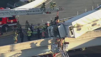 WATCH: Driver rescued from box truck hanging off Texas freeway