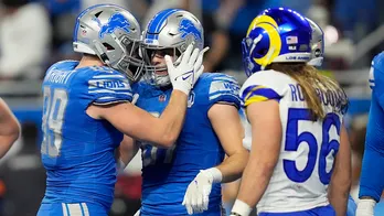 Lions win 1st playoff game in 32 years narrowly defeating Rams in wild-card round