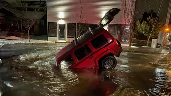 Couple escapes from car after it plunges into sinkhole in Washington state: 'Felt like the movies'