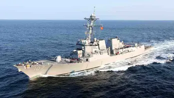 US destroyer intercepts Houthi missiles fired at US-owned container ship, official says