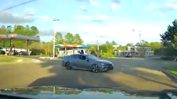 Dashcam video captures driver avoiding Jackson, Mississippi, shootout