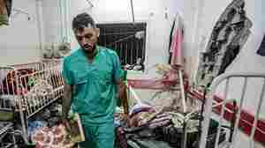 Searching for the remains of hostages, Israeli forces raid another Gaza hospital