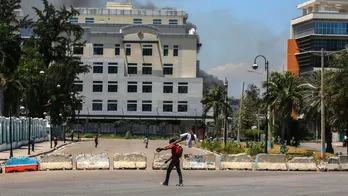 Haitian gangs loot national library amid spiraling violence that has forced thousands to flee capital city