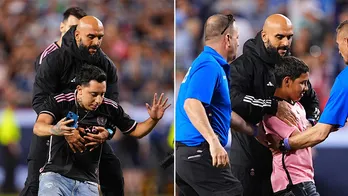 Lionel Messi's bodyguard springs into action to remove overzealous fans who tried to interact with soccer star