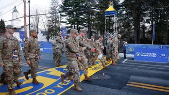 Massachusetts National Guard members kick off the 128th Boston Marathon