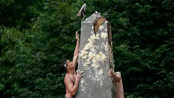 Naval Academy plebes scale greased 21-foot Herndon Monument in annual freshman year tradition