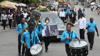 Hundreds mourn gang killings of a Haitian mission director and a young American couple