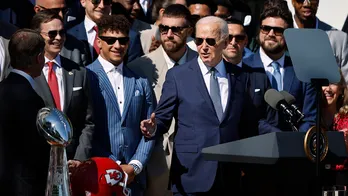 President Biden tries on Chiefs helmet; Travis Kelce jokes about last year's antics during White House visit