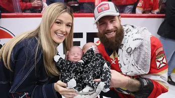 Panthers' Jonah Gadjovich, wife Allison pose with newborn twins in Stanley Cup