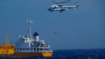 Woman swept out to sea off Japanese beach is rescued 37 hours later -- and 50 miles offshore