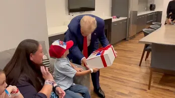 SEE IT: Trump meets young supporter with rare brain disease backstage at rally